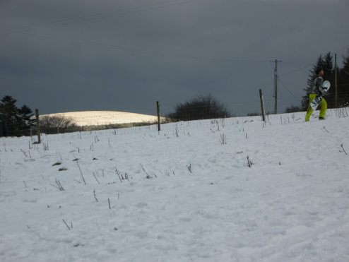 Sun peeps out to light up the top of one mountain top